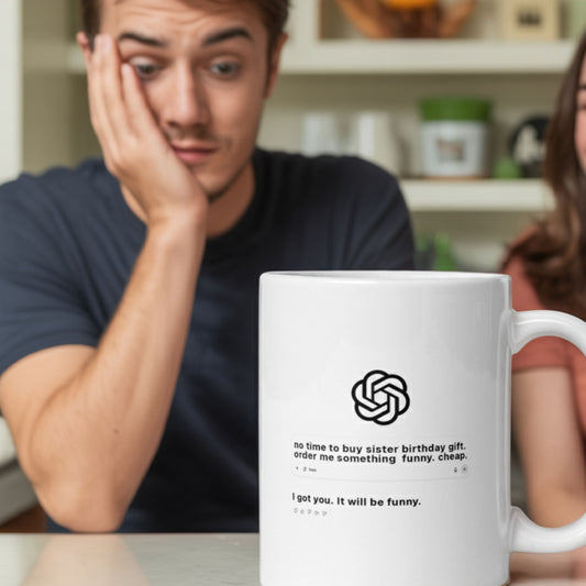 White ceramic mug featuring a mock AI chat interface with the text: “no time to buy sister birthday gift. order me something funny. cheap.” followed by the AI’s reply: “I got you. It will be funny.”  Shown in a kitchen setting with a stressed-looking man in the background. A perfect last-minute, AI-inspired funny gift for sisters.