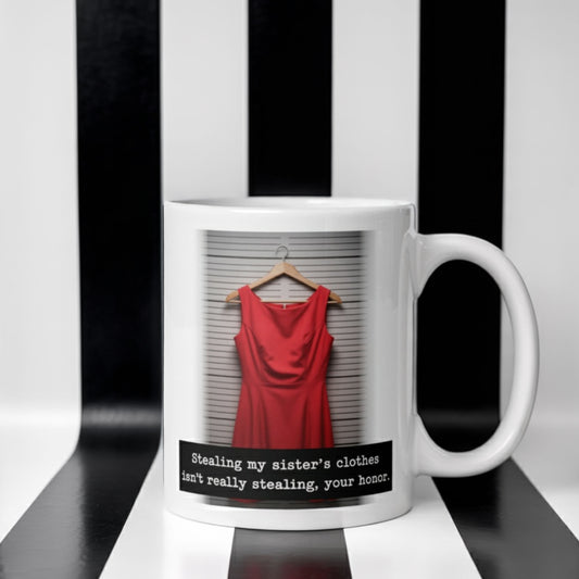 Funny sister-themed white ceramic mug with a red dress graphic and the caption “Stealing my sister’s clothes isn’t really stealing, your honor” — humorous gift idea for sisters.