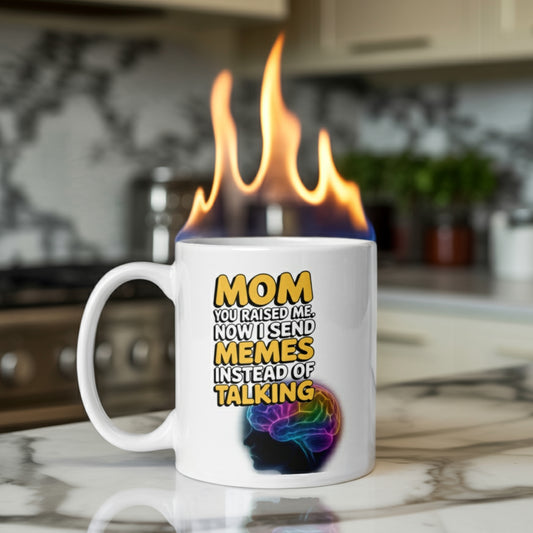 Funny meme mug for mom with bold text that says ‘Mom, you raised me. Now I send memes instead of talking,’ shown on a kitchen counter with animated flames coming out of the mug. Absurd and humorous visual, perfect gift for mom from Gen Z or meme-loving adult child.